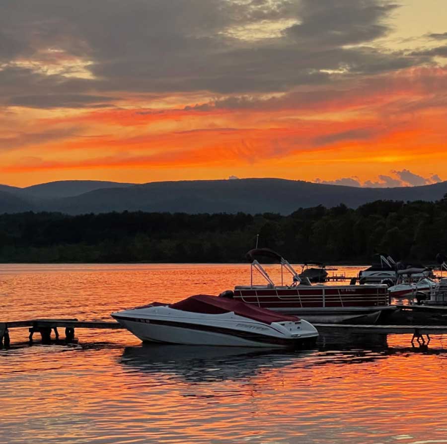 A motorboat at the club dock at sunset