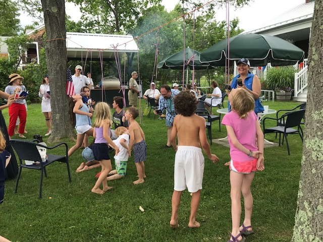 Kids lawn games Kids playing a game on the club lawn during a summer party